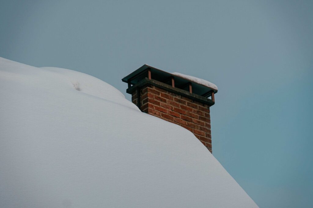 snow on the roof and chimney