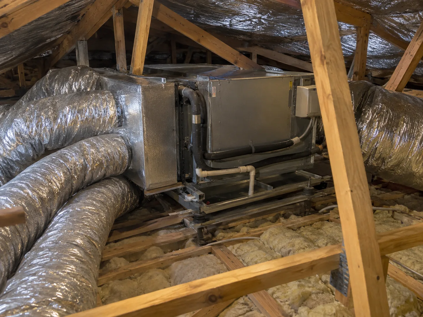 A ducted indoor unit in the roof space with insulated flexible ducts running off it