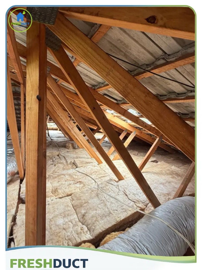 New R6.0 ceiling batts laid between the roof trusses on a FreshDuct job in Melbourne
