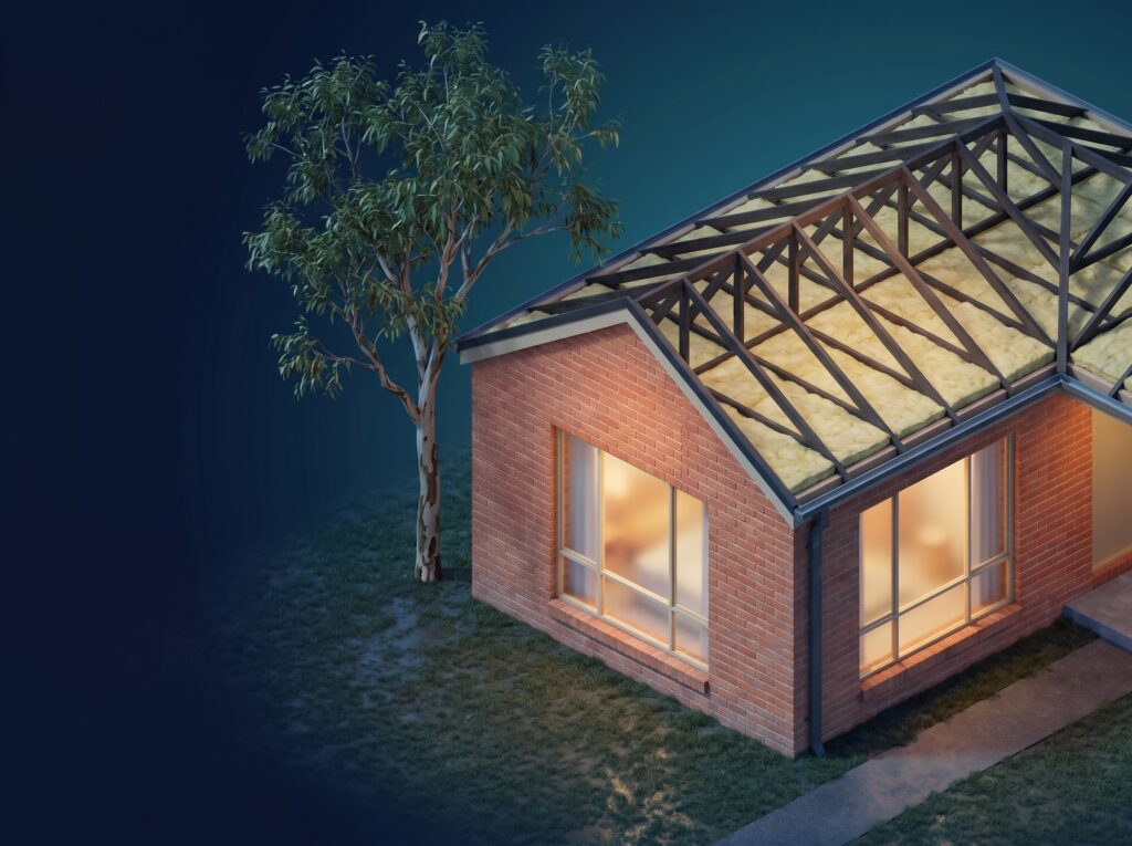 Cutaway of a Melbourne brick home at dusk: the roof is open to show thick ceiling batts lying flat on the ceiling under the trusses, with warm light inside