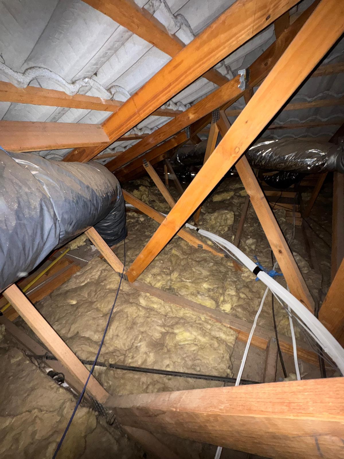 Flattened old insulation batts Keysborough roof
